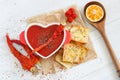 Top view of a spicy tomato soup with chili pepper and cheese crackers Royalty Free Stock Photo