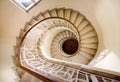 The spiral staircase in the tower. Walking down old the winding stairs Royalty Free Stock Photo