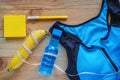 Top view of sport bra, fresh drinking water, banana, note pad, pen and measure tape on wooden table Royalty Free Stock Photo