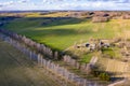 Top view of spring fields and villages. Clouds cast a shadow on the ground