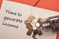 Top view stack of coins and notebook written with TIME TO GENERATE INCOME. Business and financial concept Royalty Free Stock Photo