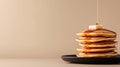 Top view of a stack of fluffy pancakes on white plate, drizzled with maple syrup and topped with fresh berries Royalty Free Stock Photo