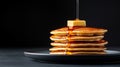 Top view of a stack of fluffy pancakes on white plate, drizzled with maple syrup and topped with fresh berries Royalty Free Stock Photo