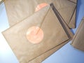 Top view of a Stack of letters in Kraft envelopes lying on the table