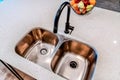 Top view of stainless steel double basin undermount sink and black curved faucet Royalty Free Stock Photo