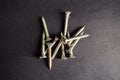 Stainless steel Star Screws Bunch on Black Background Royalty Free Stock Photo