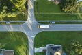 Top view of standard american yellow school bus picking up kids at rural town street stop for their lessongs in early Royalty Free Stock Photo