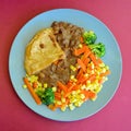 Steak and kidney pie vegetables on a plate. Royalty Free Stock Photo