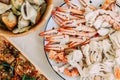 Top view of steamed Flower Crabs and Giant Mud Crabs with separated parts of steamed crab such as claw meat and body.