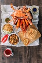 Top view of Steamed Giant Mud Crabs, Grilled Prawns Shrimps, Crab Fried RIce, Pepper and Garlic Soft-Shell Crab, Crispy Catfish. Royalty Free Stock Photo