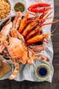 Top view of Steamed Giant Mud Crabs, Grilled Prawns Shrimps, Crab Fried RIce, Pepper and Garlic Soft-Shell Crab, Crispy Catfish Royalty Free Stock Photo