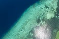 Top view of a steep drop-off at a coral reef at Pangangan Island, Calape, Bohol, Philippines. Shallow waters that suddenly drop