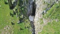 Top view of steep mountain cliffs and an ice cave. Royalty Free Stock Photo