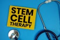Stem Cell Therapy text with Stethoscope on blue background Royalty Free Stock Photo