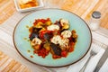 Top view of stewed eggplant with meatballs and cheese served