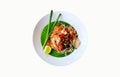 Top view of stir fried with rice noodle, river prawns or shrimp, bean sprout, sliced chives and lime on banana leaf Royalty Free Stock Photo