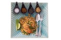 Top view of Stir Fried Rice Noodle Thai style with Prawns, side dishes and condiments or Thai people call Pad thai in plate. Royalty Free Stock Photo