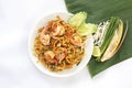 Top view of Stir Fried Rice Noodle Thai style with Prawns and side dishes or Thai people call Pad thai in white plate. Royalty Free Stock Photo