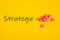 Top view of Strategie written on yellow background with red Royalty Free Stock Photo