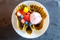 Top view of strawberry ice cream with fresh fruits inside crispy thin waffle bowl Royalty Free Stock Photo