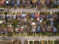 Aerial view of a residential neighborhood on an overcast winter day. Straight street. Royalty Free Stock Photo