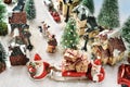 Top view on the street in a small town with two Santa Clauses with Christmas presents on the sledge Royalty Free Stock Photo