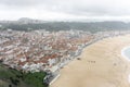 Top view of the streets with white houses and orange tiled roofs, an ancient portuguese city on the ocean Royalty Free Stock Photo