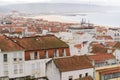 Top view of the streets with white houses and orange tiled roofs, an ancient portuguese city on the ocean Royalty Free Stock Photo