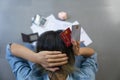 Top view of stressed young sitting Asian woman hands holding the head worry about find money to pay credit card debt and all loan Royalty Free Stock Photo