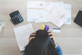 Top view of stressed young woman trying to find money to pay credit card debt. Selective focus on hand Royalty Free Stock Photo
