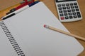 Top view of a student table with an open notebook, a pencil, a calculator, a compass and a ruler Royalty Free Stock Photo