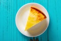 Top view studio shoot of home made cheese cake on blue table Royalty Free Stock Photo