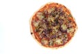 Top view studio shot of freshly baked pizza al tonno isolated on white background. Tuna, olives, onions, veggies, crust Royalty Free Stock Photo