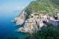 Top view of the stunning color of the sea, the mountains and the train station of Riomaggiore . Coast Riomaggiore of Cinque Terre Royalty Free Stock Photo