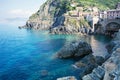 Top view of the stunning color of the sea, the mountains and the train station of Riomaggiore . Coast Riomaggiore of Cinque Terre Royalty Free Stock Photo