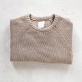 Top view on a stylish beige knitted warm sweater. Winter trendy casual men`s knit clothing. Fashionable youth knitwear for men. Royalty Free Stock Photo