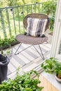 Top view of stylish rattan chair on the balcony of modern flat, real photo