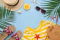 Top view summer beach frame mockup. Female hipster traveler accessories. Palm leaf, rattan bag and hat. Copy space