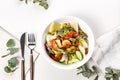 Top view summer salad with fresh vegetables, fried shrimps, cheese and herbs. Seasonal vegetables, seafood and goat cheese. Royalty Free Stock Photo