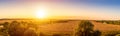 Top view of a sunset or sunrise in an agricultural field with ears of young golden rye. Rural panorama Royalty Free Stock Photo