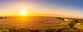 Top view of a sunset or sunrise in an agricultural field with ears of young golden rye. Rural panorama Royalty Free Stock Photo