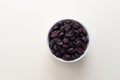 Top View Superfood Heap Of Dried Cranberries In White Bowl On Beige Background. Copy Space