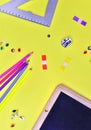Top view on suplies of school on yellow paper Royalty Free Stock Photo