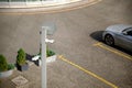 Top view surveillance camera in an open parking lot near a hotel