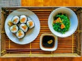 Top view of sushi soy sauce and seaweed salad on bamboo tray Royalty Free Stock Photo