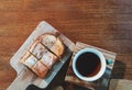 Top View of Sweet Bread Serve on Cutting Board with Hot Tea. Lay on Wooden Table Royalty Free Stock Photo