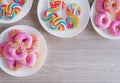 Top view, sweet food on wooden table. Glazed mini donuts and candy sugar