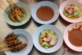 Top view, sweet and sour sauce and satay pork on the table