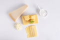 Top view of Swiss cheese and a piece of parmesan cheese isolated on a gray background