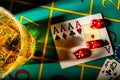 Top view of table in casino with glass of whiskey and set of four aces. Close up of a dark gambling table with booze Royalty Free Stock Photo